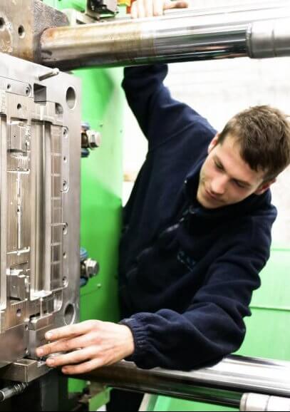 Rubber moulding UK Men at work, silicone, rubber and plastic moulding, custom moulding services UK
